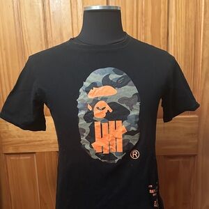 Bape Black Graphic T-Shirt with Camouflage and Orange Design